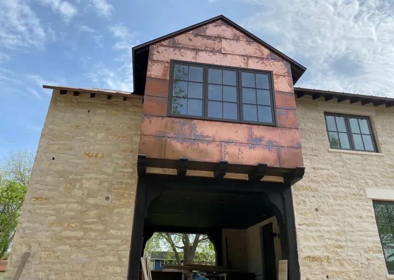 Copper metal panel facade on a stone building for Skylight Installation in Tehachapi