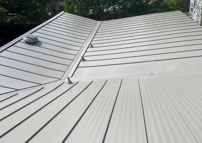 Solar attic fan installed on a metal roof for Roof Ventilation in Tehachapi